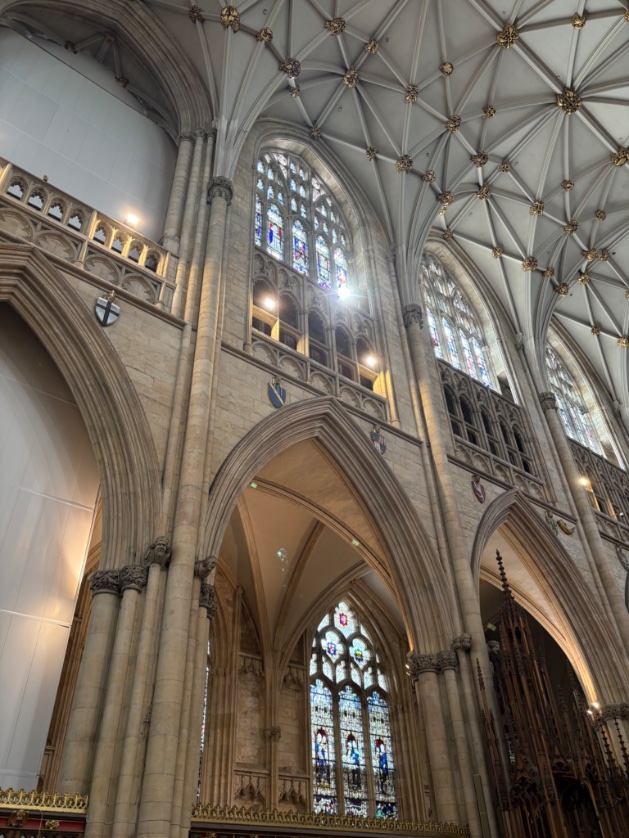 The light of Christ: when the flower arrangement is done but Jesus thinks differently and sends a sunbeam through the stunning blue stained glass of #YorkMinster