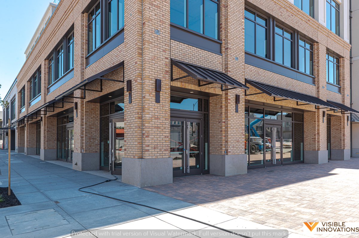 These metal awnings were installed in 2021, and it added interest and sun protection to this simpler building's design.