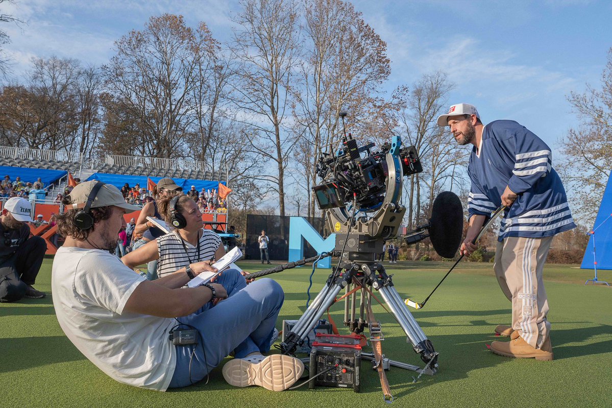 NJGov's tweet image. Filmed in Jersey 🎬
HAPPY GILMORE 2. - BTS - (L to R) Director Kyle Newacheck and Adam Sandler as Happy Gilmore (Writer/Producer) with crew members on the set of Happy Gilmore 2. Cr. Scott Yamano/Netflix © 2025.