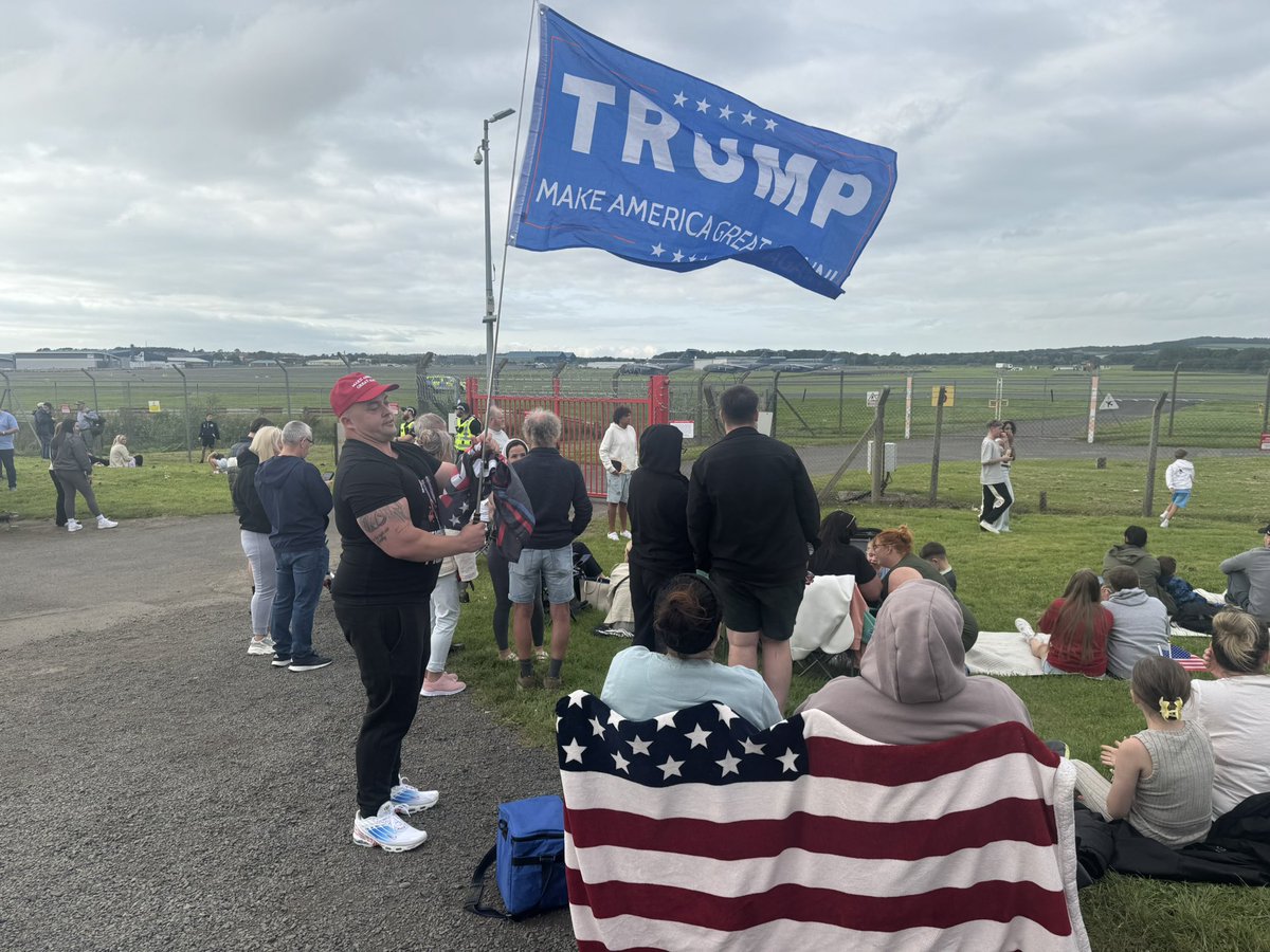 At Prestwick Airport awaiting the arrival of President Trump. A large crowd here including this man showing support for Donald Trump - <a href="/LBC/">LBC</a>