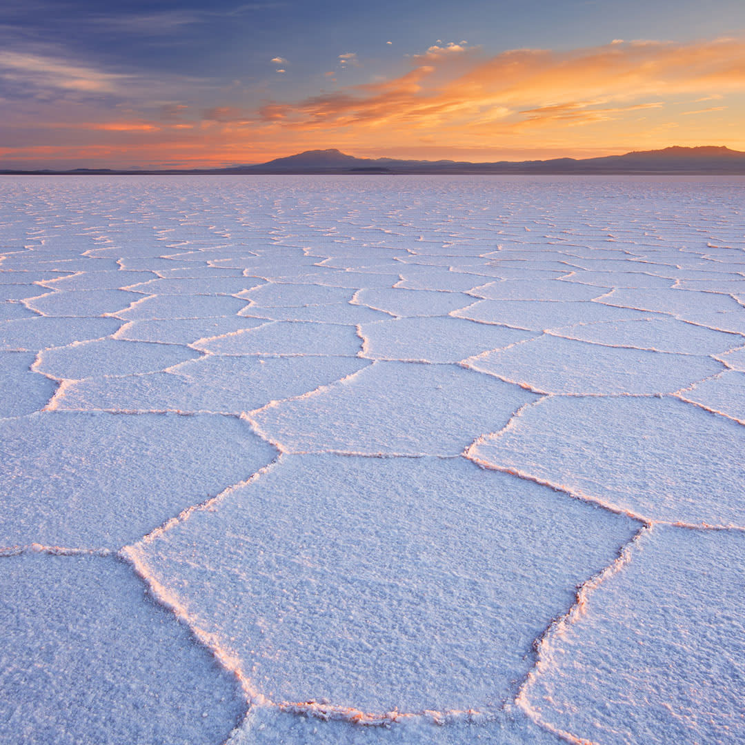Bolivia’s Salar de Uyuni is a dazzling stretch of salt desert that you must see to believe! By day, discover flamingo-filled lakes &amp; incredible geysers; by night, gaze up at stars so bright they hardly seem real. Let’s chat!