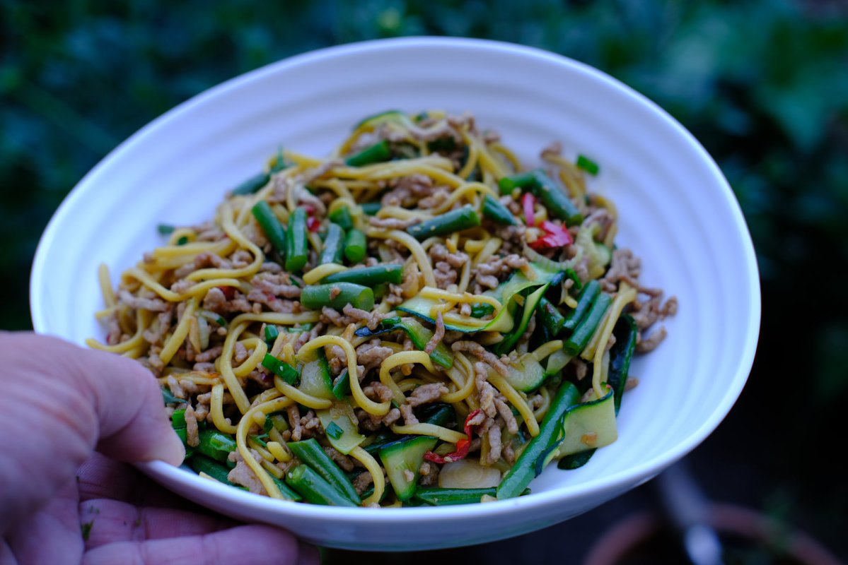 Dad’s been cooking. 
Stir fried pork and noodles. Smashed garlic, chilli and ginger.
Then picked from the Allotment; green beans (pre boiled), shaved courgette ribbons, spring onions and coriander. 
Add a splash of soy, wine and fish sauce 😋