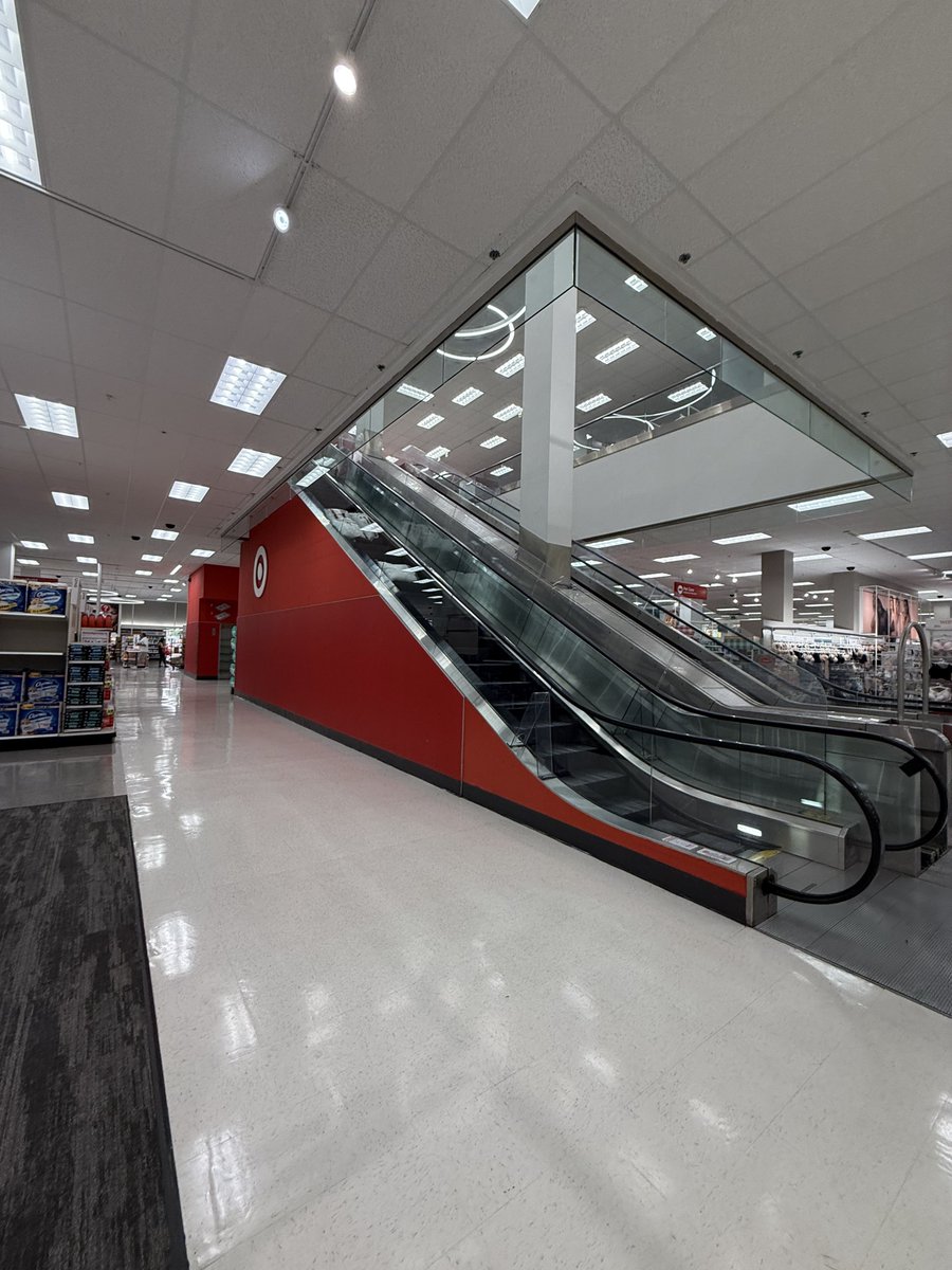 glittersnot's tweet image. someone tried to take their cart down the escalator at target and it fell all the way down??? 😭