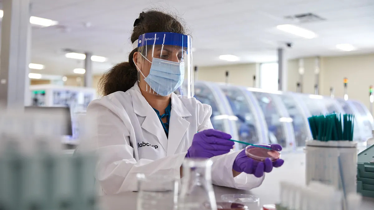 The agreement includes outreach laboratory services in 13 states. CHS will continue to operate its inpatient and emergency department laboratories and other hospital-based testing services.
#Labcorp technicians performing testing