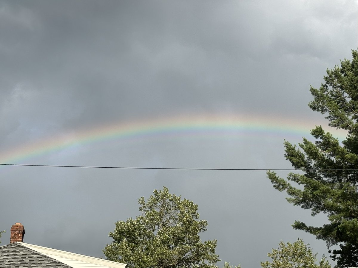 sub__tara's tweet image. Same moment as the sun sets in Massachusetts 7.25.25. Rainbow to the east, other things to the west.