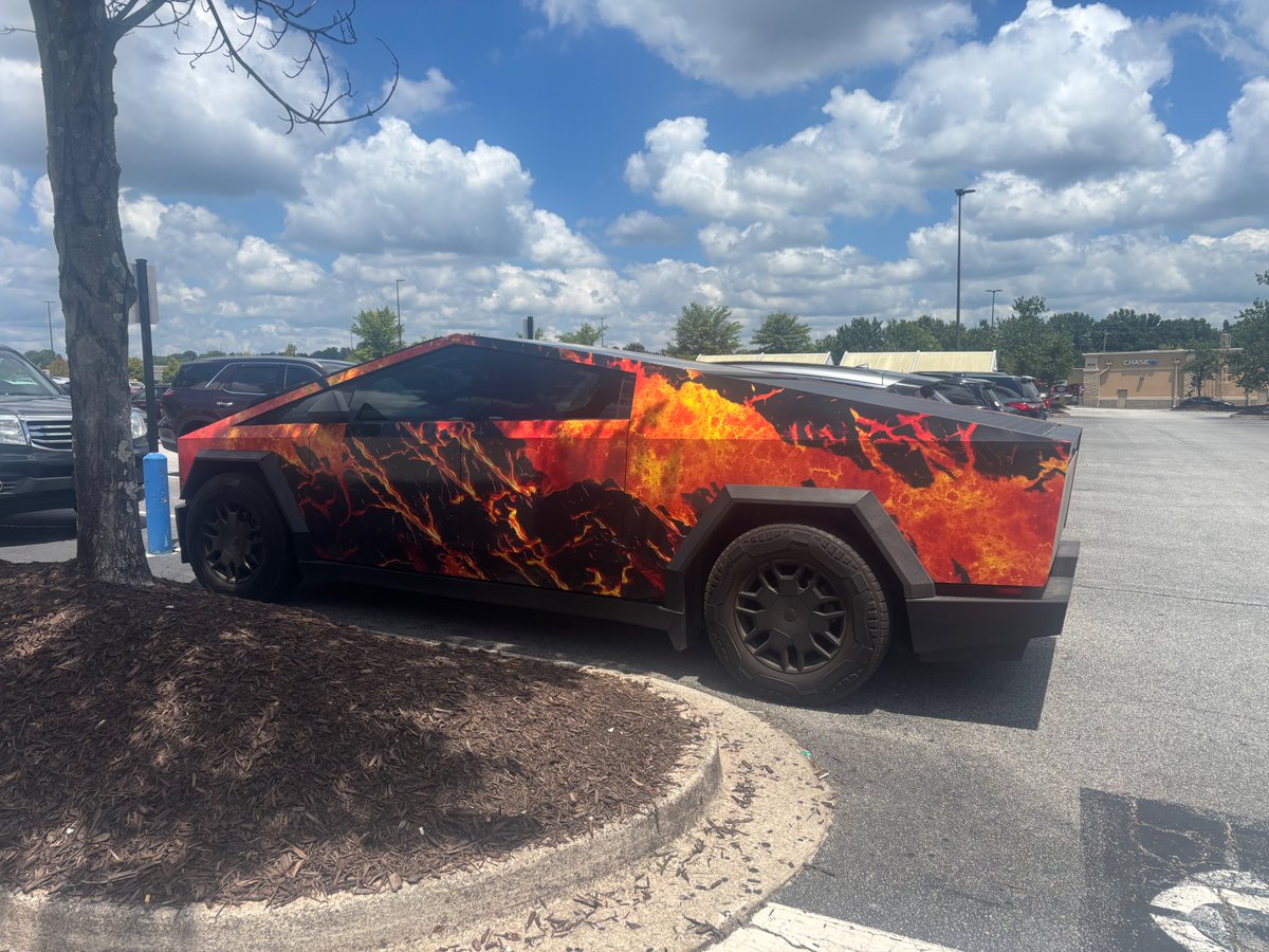 As I was coming out of a store, I happen to run into a lady who was exiting this Tesla. It was SO cool, I asked her if she minded if I took a pic, and she said “of course not, it’s better than being flipped off!” Anyway, it is Hawaii mountains and lava! <a href="/Tesla/">Tesla</a>