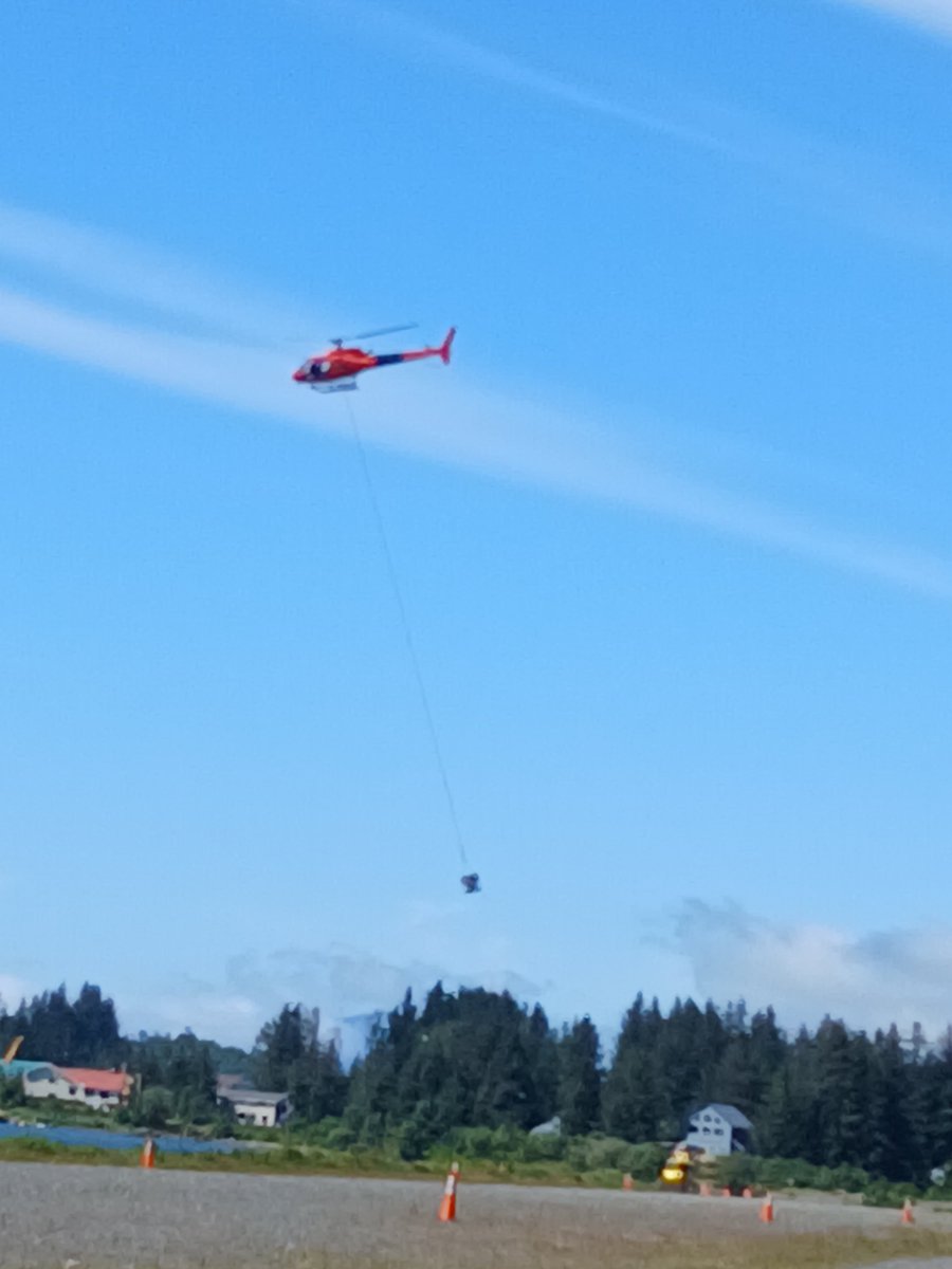 Jbn3ex's tweet image. Some construction project in the bush was going on when we were in town. They had a few helicopters flying to a cement truck in rotation and getting these baskets pumped full. I dont know how anyone affords to build anything in Alaska