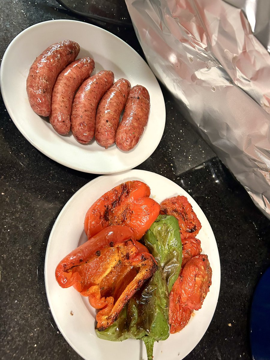 whatkenatetoday's tweet image. Hot butter over fresh garlic and parsley for this grilled broil. Brats and grilled veggies.
