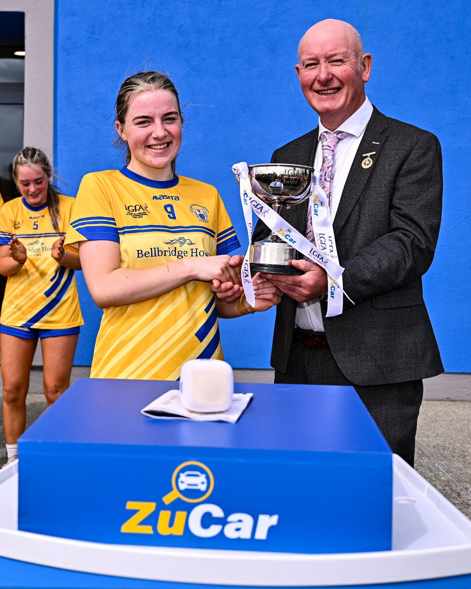🏆 <a href="/Clarelgfa/">Clare LGFA</a> captain Aisling Crowe receives the cup from LGFA Vice-President Brendan Cregg after victory in the ZuCar All-Ireland U18 B Ladies Football Championship final match between Clare and Sligo at Connacht GAA Centre of Excellence.

#zucaru18