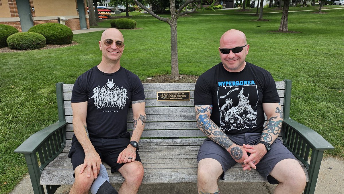 hyperborea576's tweet image. Here I am with my friend, Joe Mac, sitting on the Gary Gygax Memorial Bench in Lake Geneva, WI. Joe and I first met through a mutual love for all things Gygax around 2010, and we've been fast friends ever since. We're having a great time at EGG Con!