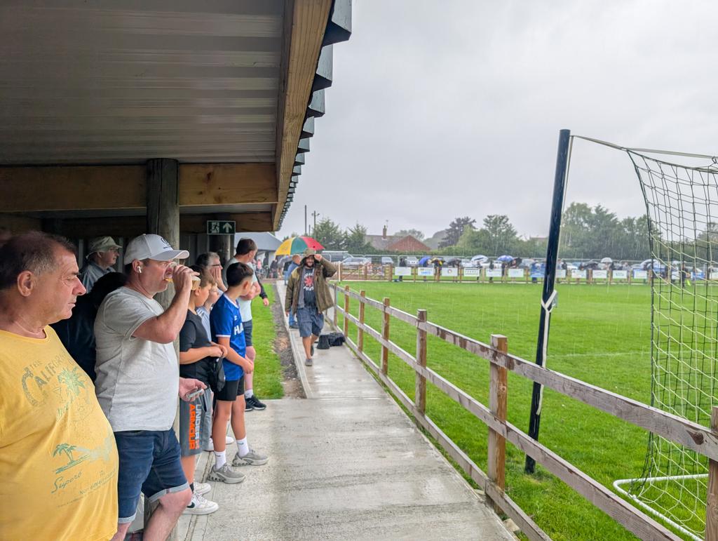 CovertFootyTrip's tweet image. As both teams enter the pitch, the heavens open, a nice soggy team photo for @HalesworthClub to start the season as we cover under a glorious little stand behind the goal. Great to see another club persistent with printed programmes ๐
