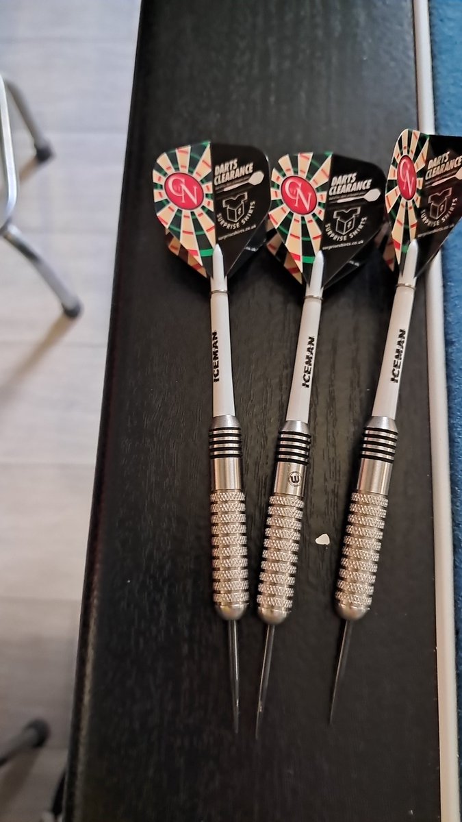 CameronCairns87's tweet image. I got the old darts out, decided to mix and match the stem and flights. I found some old @SurpriseShirts flights I was gifted a long time ago. Happy days.
(Yes I am still rubbish at darts but I love the game.)