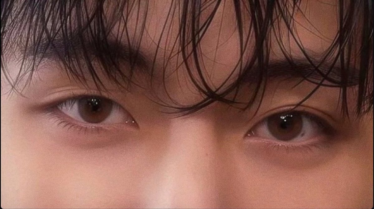 Taeveurr's tweet image. Taehyung’s eyes are twin chalices of obsidian velvet, steeped in midnight ink and laced with whispers of forgotten kingdoms. They shimmer like dusk-touched sapphires bathed in moonlight, holding court beneath the arch of celestial lashes, regal and reverent.