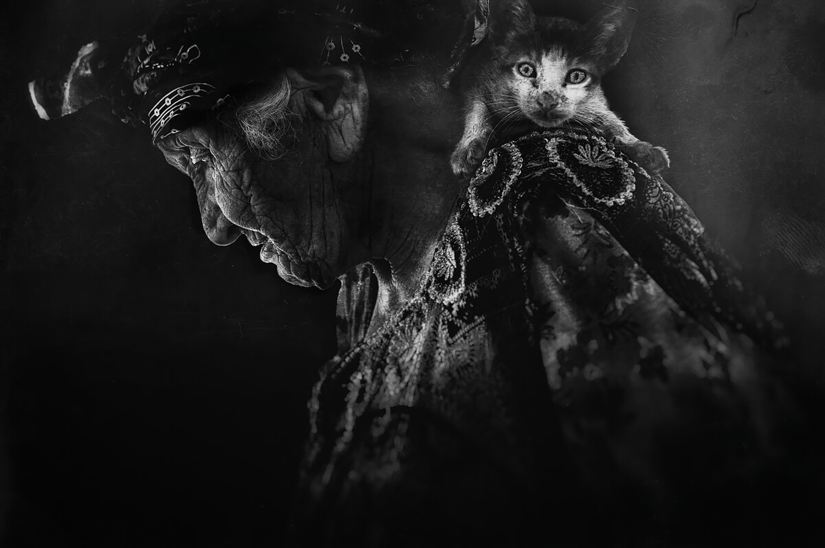 As a seasoned photographer, <a href="/imed_kolli/">iK</a> delicately blends creative imagery with heartfelt empathy and nuanced observation.
His work is a "powerful spiritual iconography," a means to offer his subjects a glimmer of light, joy, and hope—to remind them they are not forgotten...