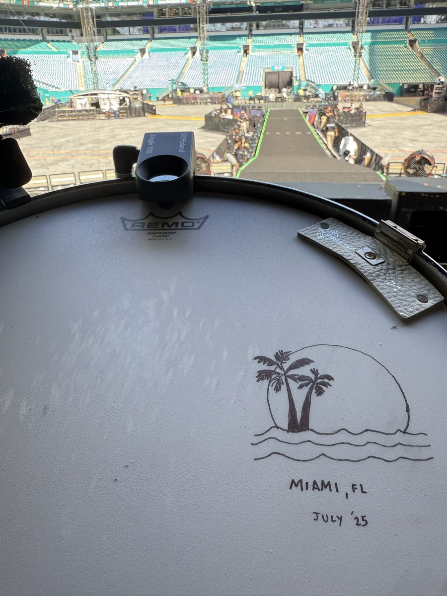 coldplay's tweet image. A final instalment for USA ‘25, what a way to finish..!  Growing up in the UK in the ‘80s, seeing the shining aqua of Dan Marino’s #13 shirt on tv was like beaming the Florida sunshine into our living room. A fitting way to end this leg of the tour, thank you to everyone who has…