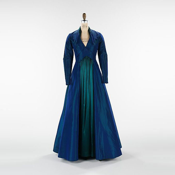 TheVFG's tweet image. Elizabeth Hawes designed this 1936–37 extraordinary evening ensemble named “The Styx.” The dress and matching bolero combine sculptural construction with dramatic blue-green iridescent silk—echoing the movement and mystery of the river from which it takes its name. The MET