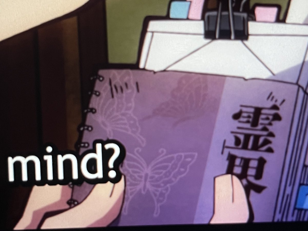 akane has butterflies on his notebook that says spiritual Use… idk its cute