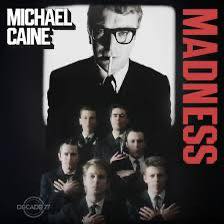 He's walking – where? I'm afraid I don't know
I see the firemen jumping from the windows
There's panic and I hear somebody scream (Aah!)

He picks up useless paper and puts it in my pocket
I'm trying very hard to keep my fingers clean
I can't remember, tell me – what's his name?