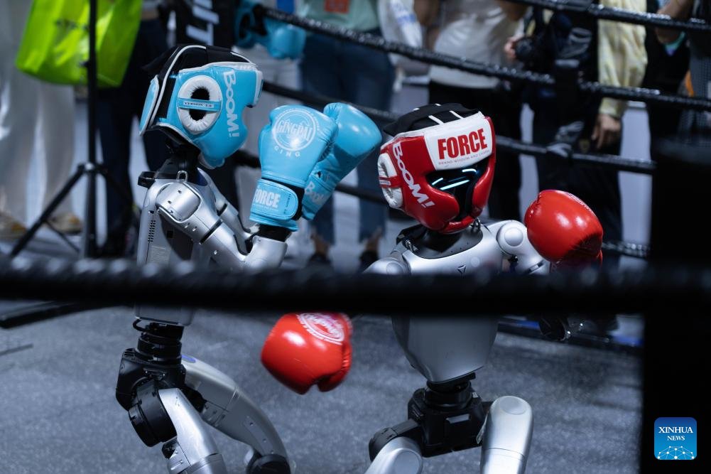chinafrica1's tweet image. Boxing robots are displayed at the #2025WorldRobotConference (WRC) in Beijing, Aug. 8. The 2025 WRC that kicked off on Friday in #Beijing unveiled future development trends of embodied intelligent robots, focusing on fields such as cognition, decision-making and safety.