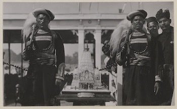Bihar Digital Archive (@archiveofbihar) on Twitter photo Photograph of two men beside a silver casket representing the Mahabodhi Temple, presented to the Prince of Wales at the Patna Durbar on 22 December 1921. The casket, on a marble and wooden base, contains an Address of Welcome and features an inscribed plaque.
© <a href="/RCT/">Royal Collection Trust</a> Photograph of two men beside a silver casket representing the Mahabodhi Temple, presented to the Prince of Wales at the Patna Durbar on 22 December 1921. The casket, on a marble and wooden base, contains an Address of Welcome and features an inscribed plaque.
© <a href="/RCT/">Royal Collection Trust</a>