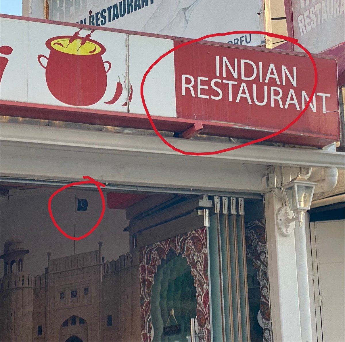 'Indian restaurant' outside 

'Pakistani flag' Inside 😅