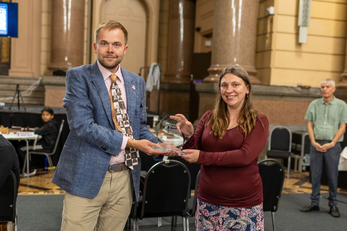 Before Round 7, we paused to IM Adam Hunt, who sadly passed in Dec 2024.
A brilliant player, coach &amp; author, Adam inspired countless young talents.

He was awarded the ECF President’s Award for Services to Chess, accepted on his behalf by his sister IM Harriet Hunt.