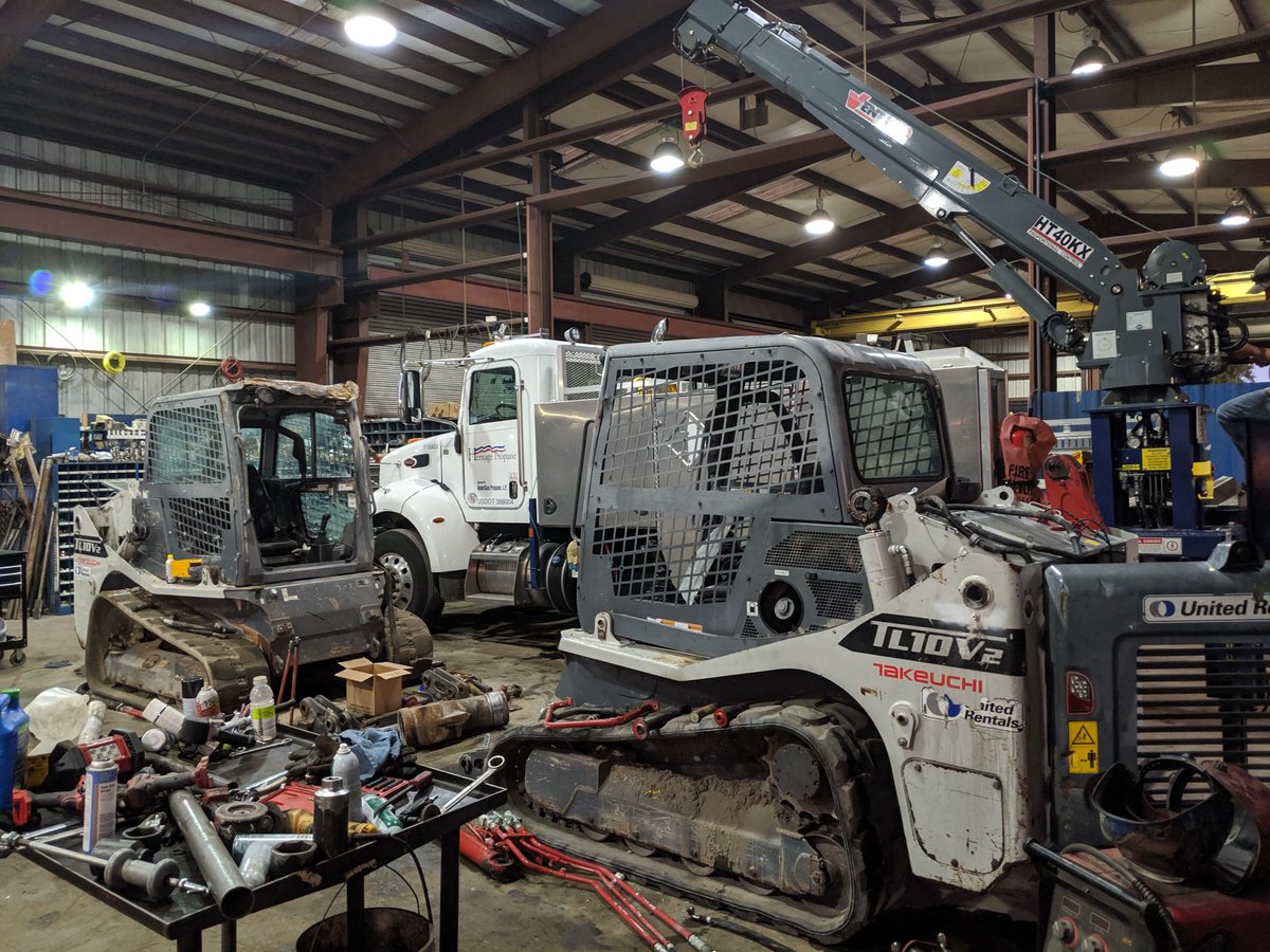 Two skid steers in for repair — just another day in a shop that’s always moving. Question for you: would you trust a spotless, empty shop… or one packed with machines, tools, and techs in every corner getting work done?