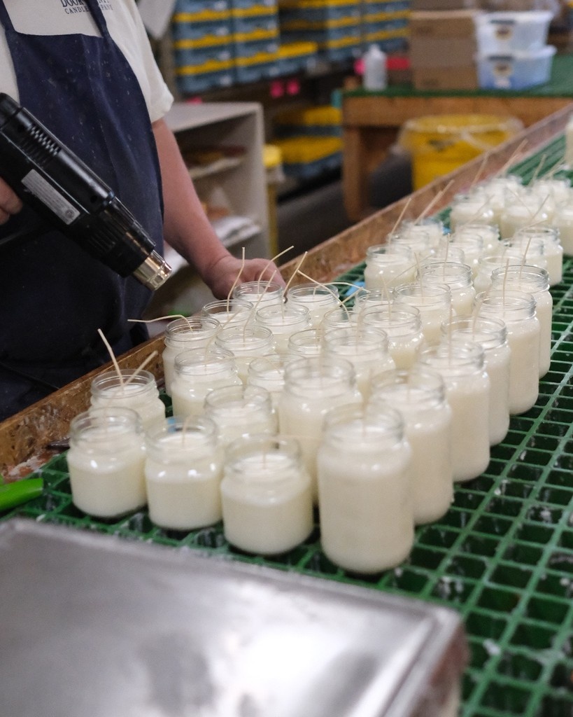Stacks of wicks, plenty of wax, and the quiet hum of a team that hand-pours every candle with care. Here’s a peek into the process that makes the magic. #candlescreatingchange #candleshop #doorcounty #travelwi #travelwisconsin #doorcountywisconsin #handpouredcandle