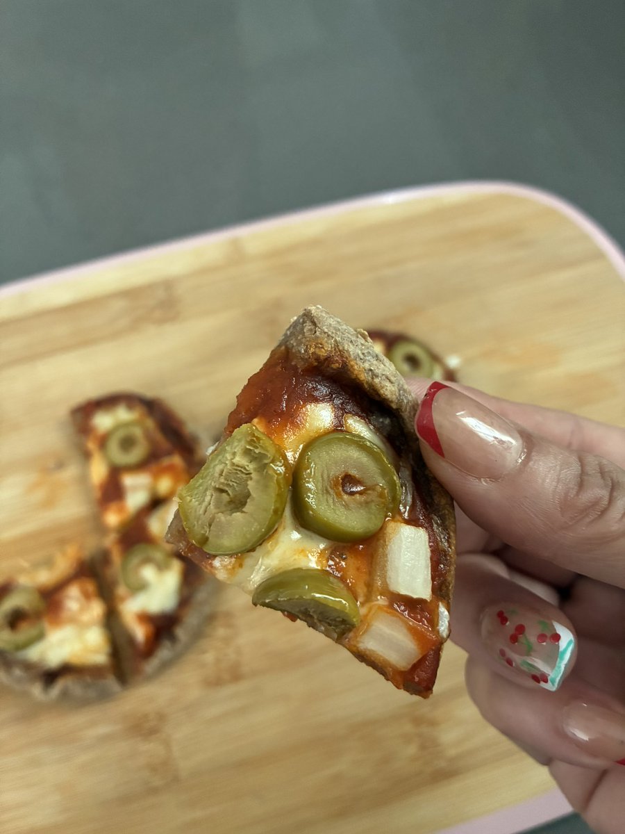Remember the sprouted tortillas I made?  Well, I just made little pizzas out of the dough and IT’S AWESOME!