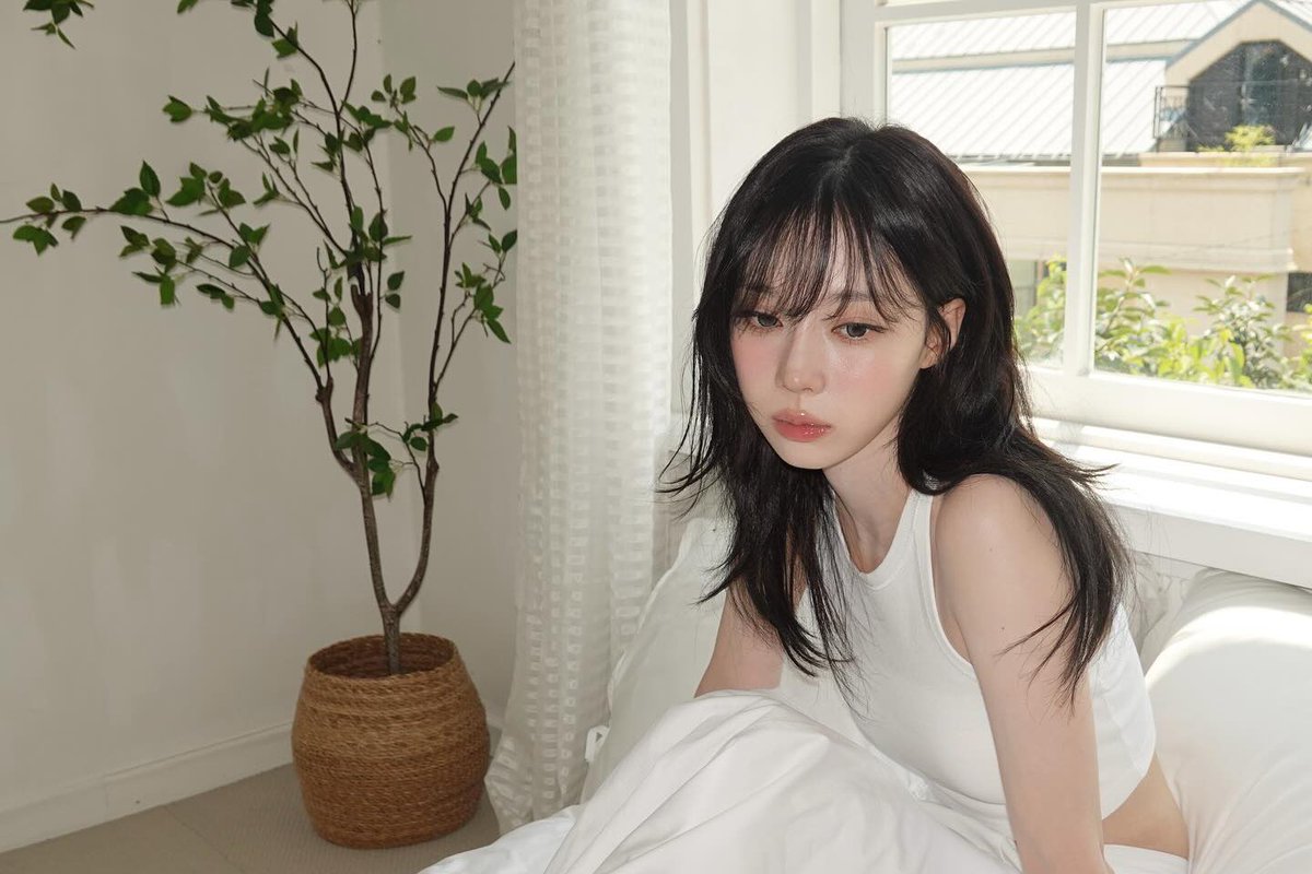 The world feels so vast from here, yet I'm completely content in this small, sunlit space that's all my own.