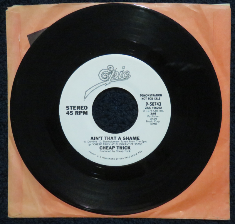 Today in Cheap Trick history: 8 Aug – (1979) “Ain’t That a Shame” debuted at #82 in this week’s Billboard Hot 100 chart. It would go on the spend 10 weeks on the chart, peaking at #35.