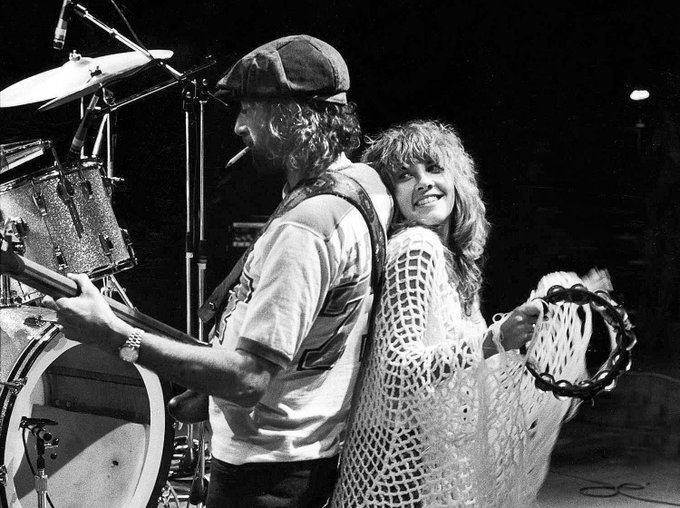 John McVie and Stevie Nicks during a Fleetwood Mac concert, 1977