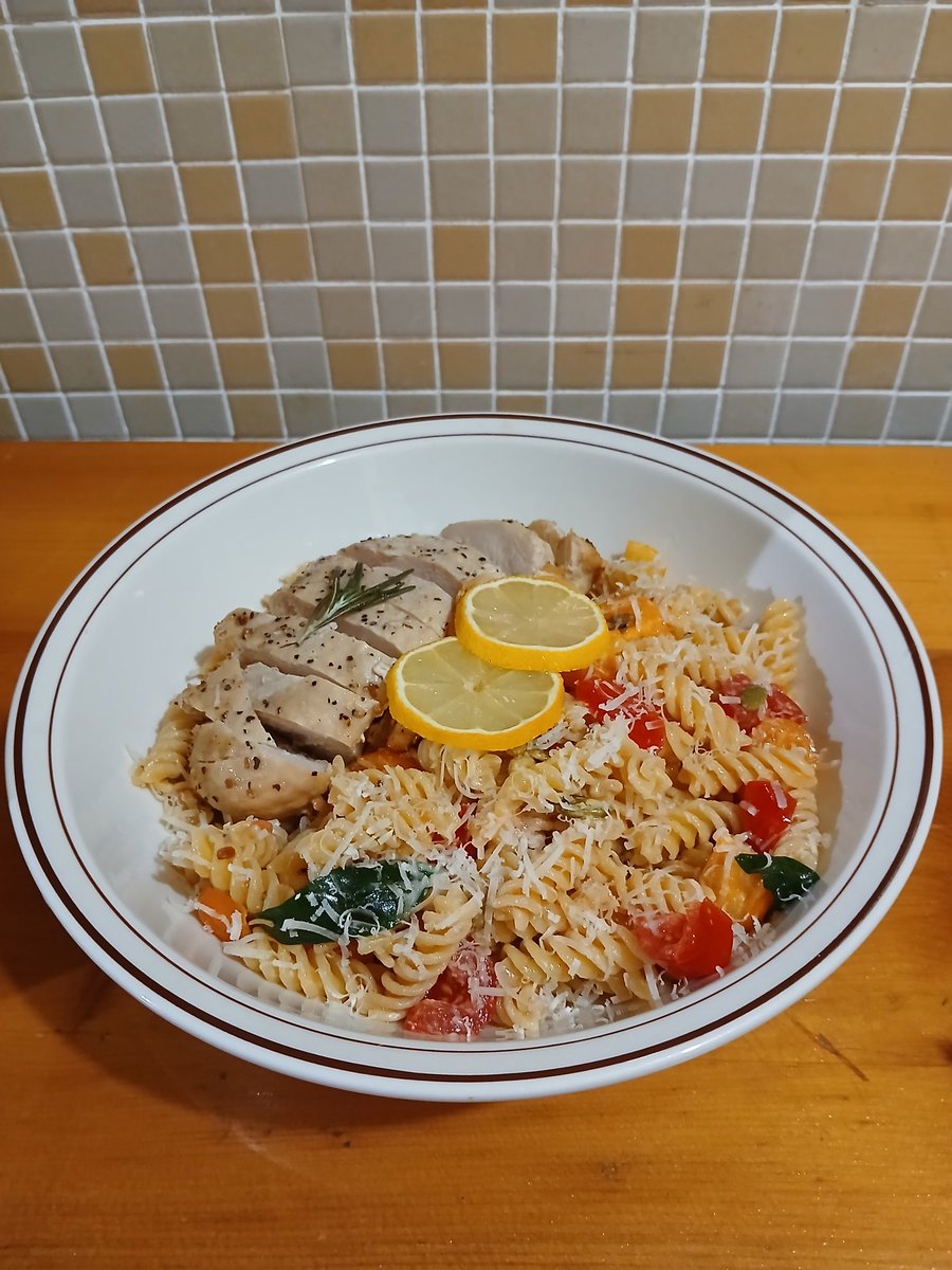 Lemon drizzled roast chicken with cracked pepper and butter sautéed tomatoes, lambsquarters, and rosemary with a dollop of sour cream folded into fusilli noodles with grated parmesan.