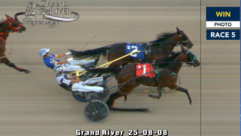 QUEEN OF THE DECK pacing to a new mark of 1:54.2 <a href="/GrandRR/">Grand River Raceway</a> - edging out the heavy fave and topping a 20-CENT HI5 worth $2,846.74!