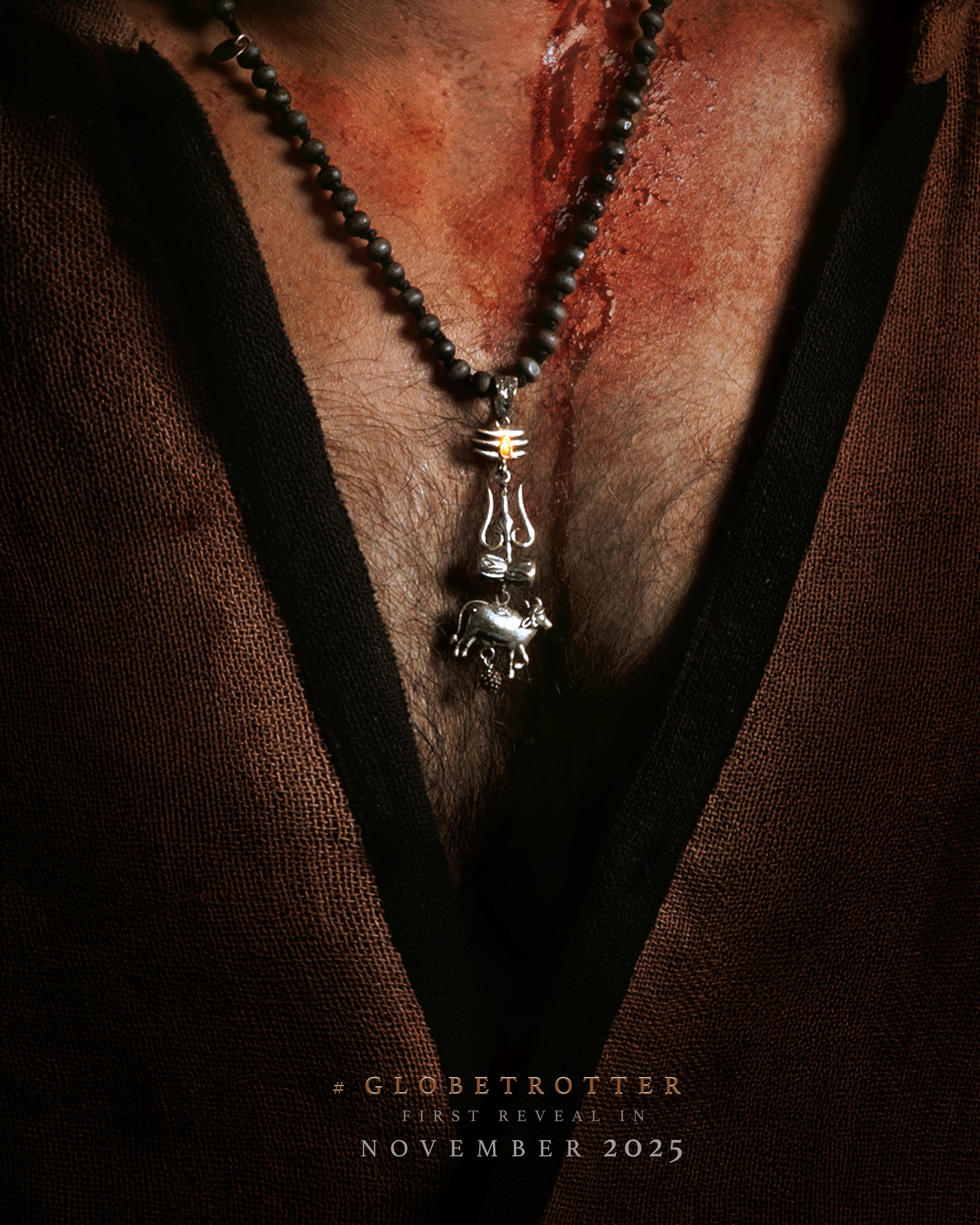 SSMB29 teaser image featuring symbolic locket, possibly referencing Lord Shiva