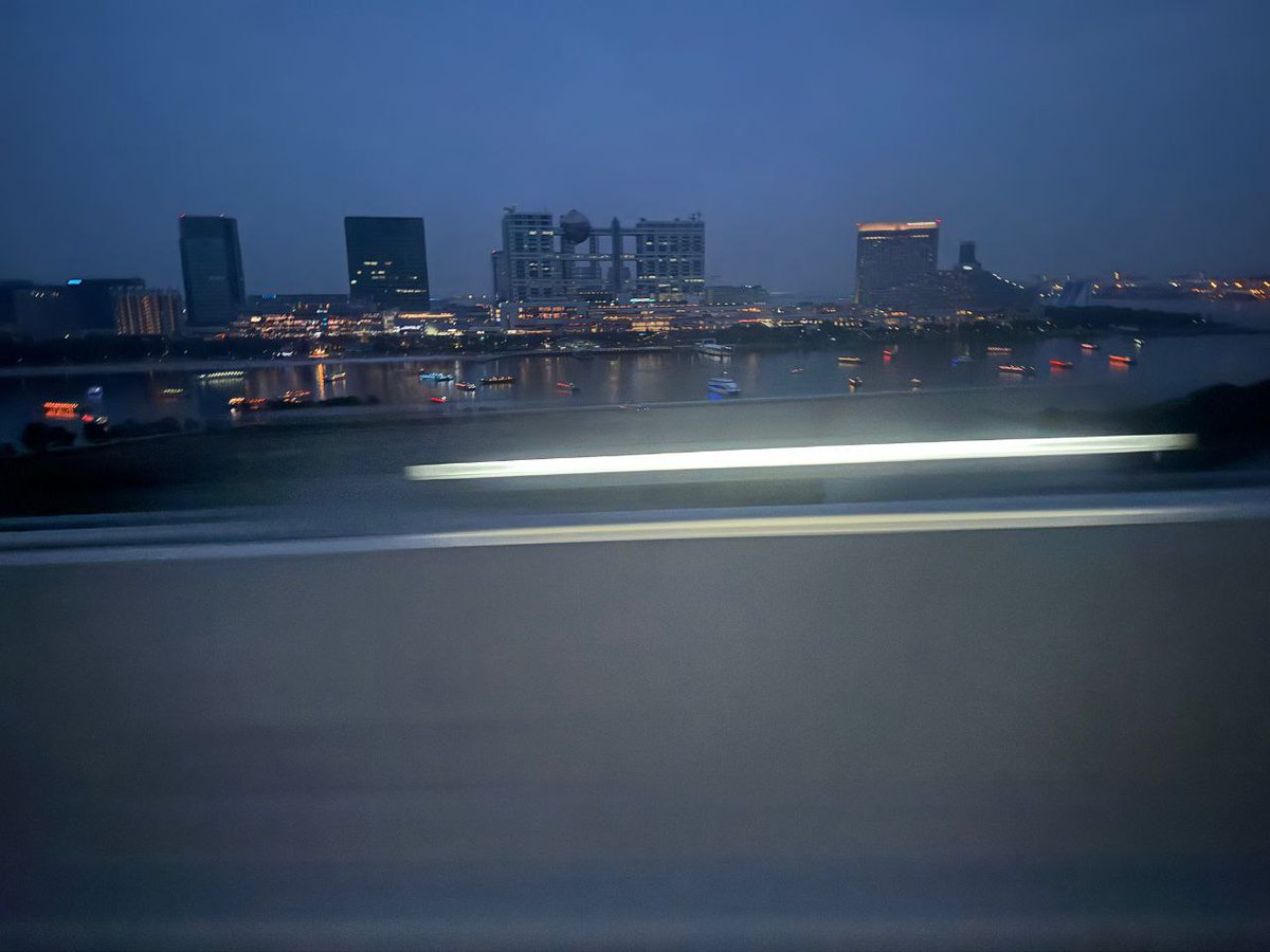 Hanging out at the studio earlier, then heading out and catching that city view across the water with all the lights hitting different. The day went from bright indoor setups to this calm night scene, and it just felt like switching from one chapter to another.