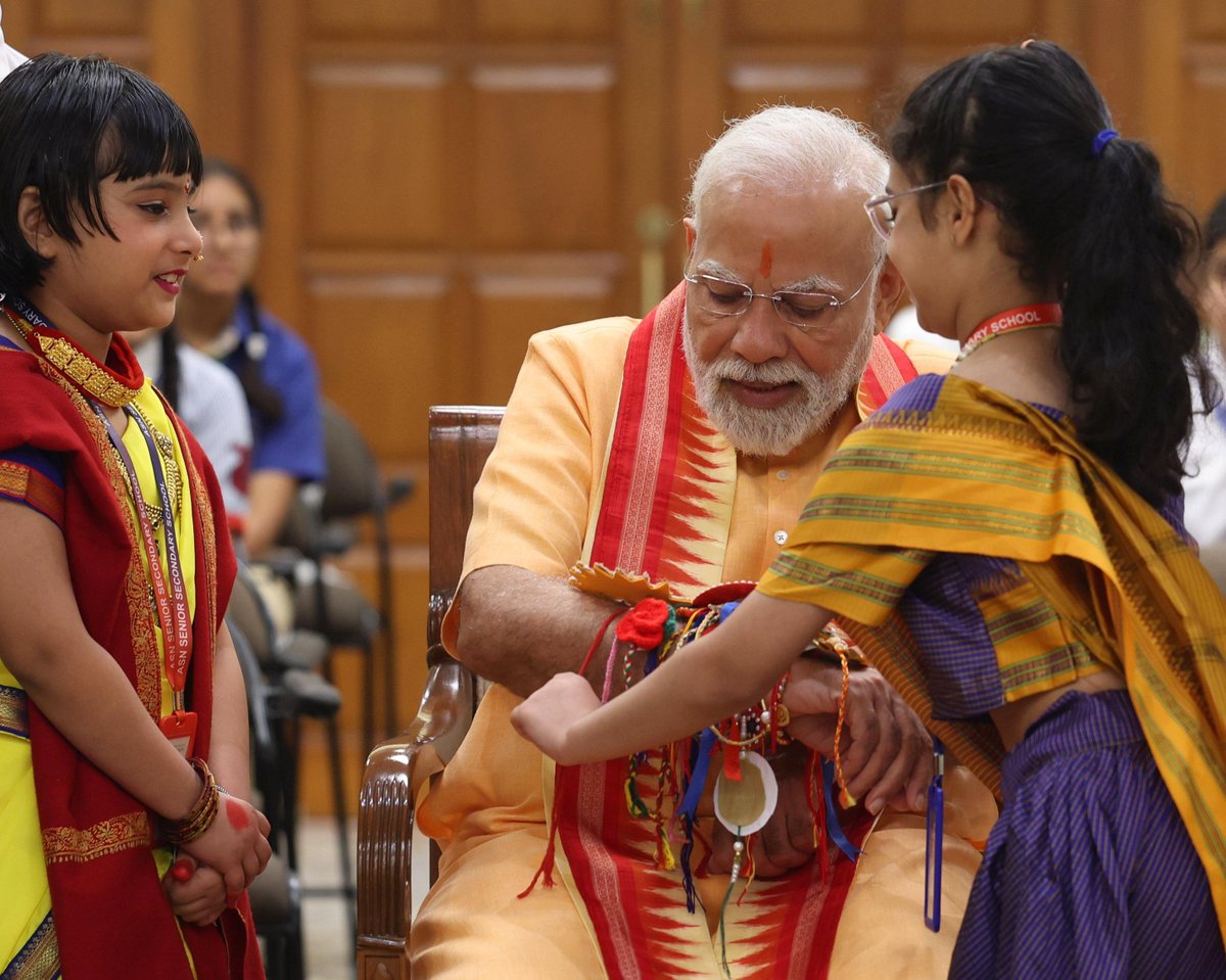 ANI's tweet photo. Prime Minister Narendra Modi celebrates #RakshaBandhan2025 with children at 7 LKM, the PM's residence, in Delhi. https://t.co/1BsJJxnmud