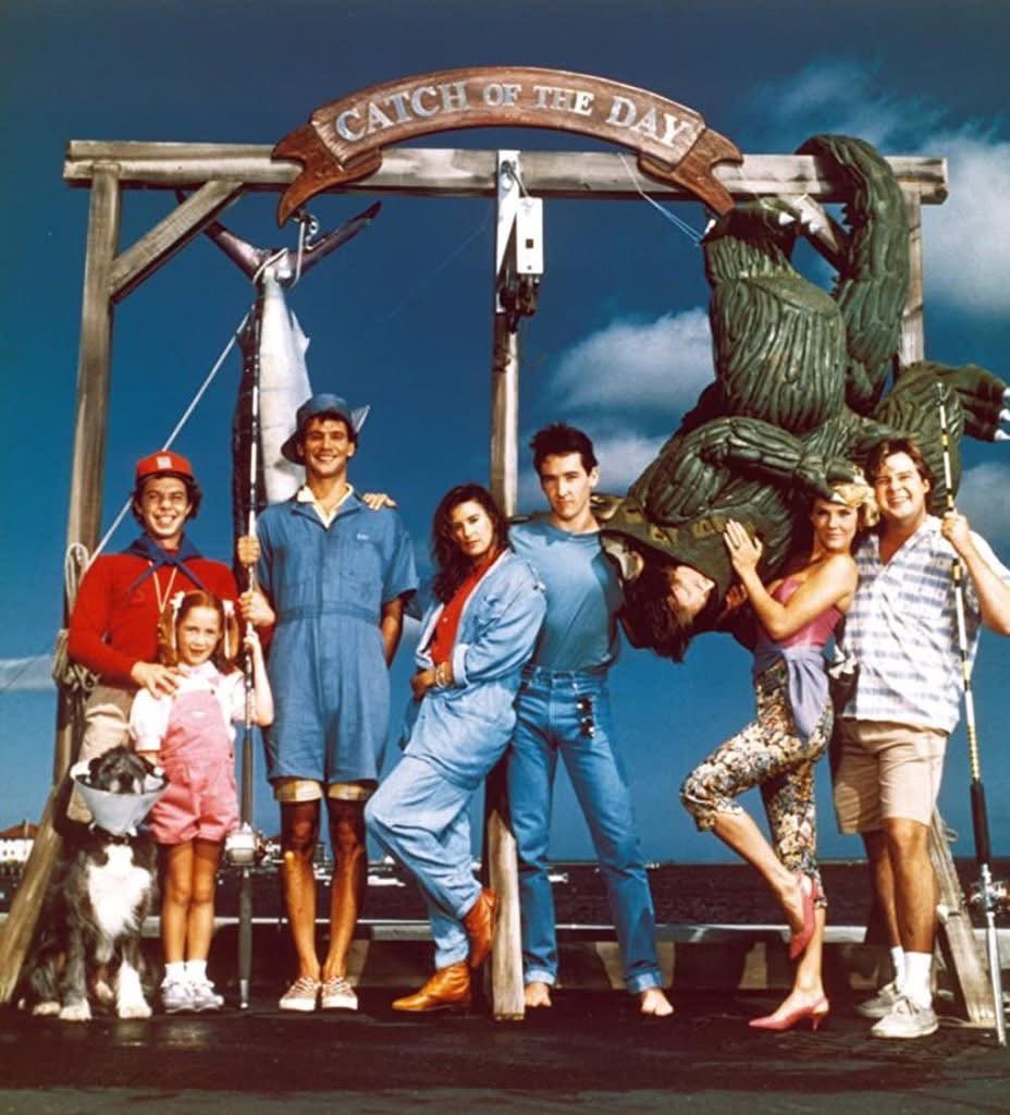Released August 8, 1986, One Crazy Summer is a romantic comedy film written and directed by Savage Steve Holland, and starring John Cusack, Demi Moore, Bobcat Goldthwait, Curtis Armstrong and Joel Murray.