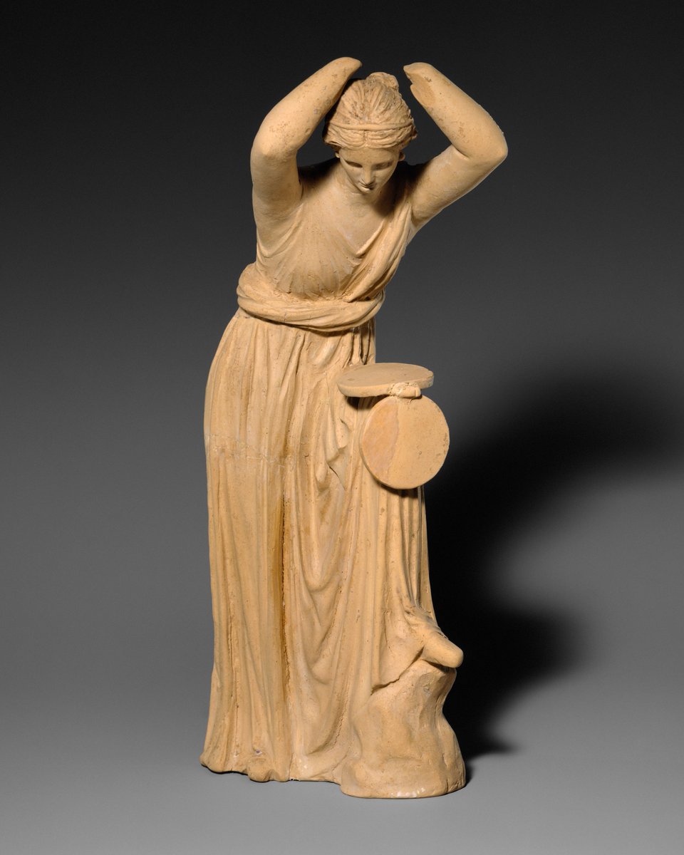 Terracotta statuette of a woman looking into a box mirror, Greek, 3rd–2nd century BC, Metropolitan Museum of Art.