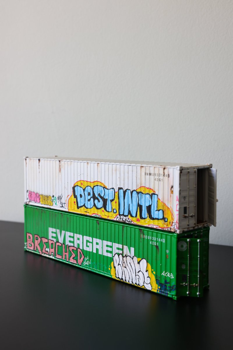 destruct_intl's tweet image. made some miniature breached / destructionist international branded shipping containers, because why not?