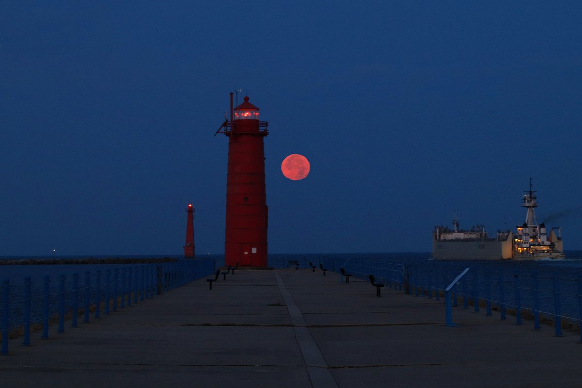 Sturgeon Moon. Moonset August 9, 2025 #muskegonchannel #southpierheadlight as the Integrity leaves the channel. #moon #SturgeonMoon  #weather