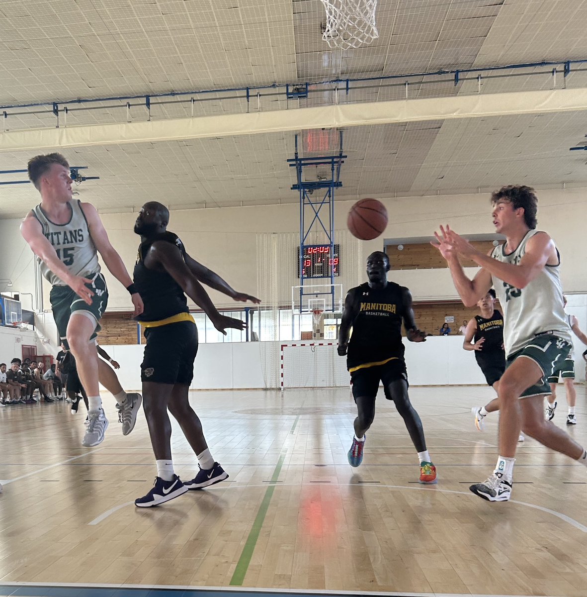 Dylan Schmidt banks in a runner in the final seconds of the half. The Titans take a 37-30 lead over the Manitoba Bisons. Karlo Colak is tops with 9 pts. Brady Kuehl, with this nifty helper from Jackson Niego, has 7 pts.