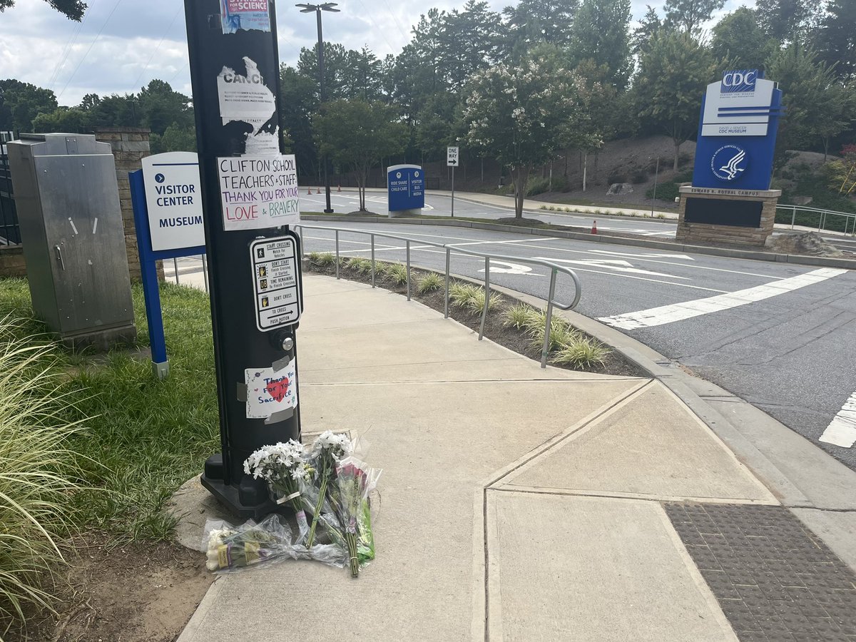 Flowers sit outside the entrance of the CDC to honor the life of DKPD Officer David Rose who was shot and killed here yesterday. The CDC Director says at least four of their buildings were damaged by gunfire. <a href="/FOX5Atlanta/">FOX 5 Atlanta</a>