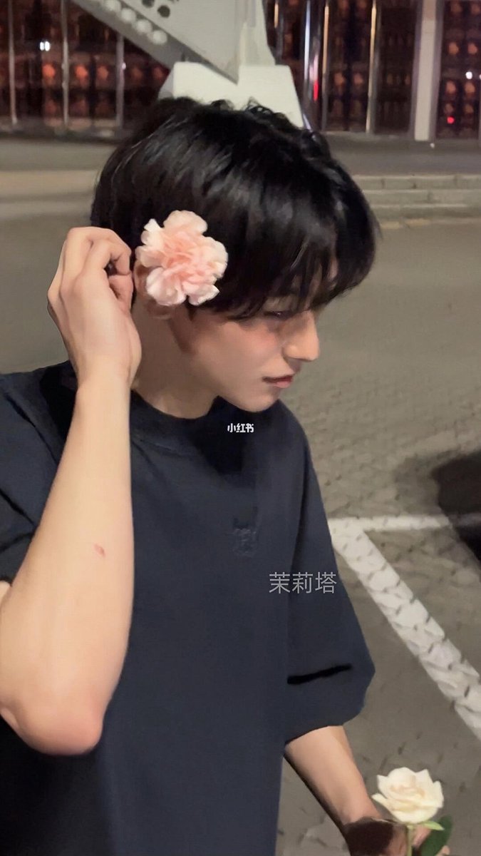 juyeon with a flower tucked behind his ear 🫠