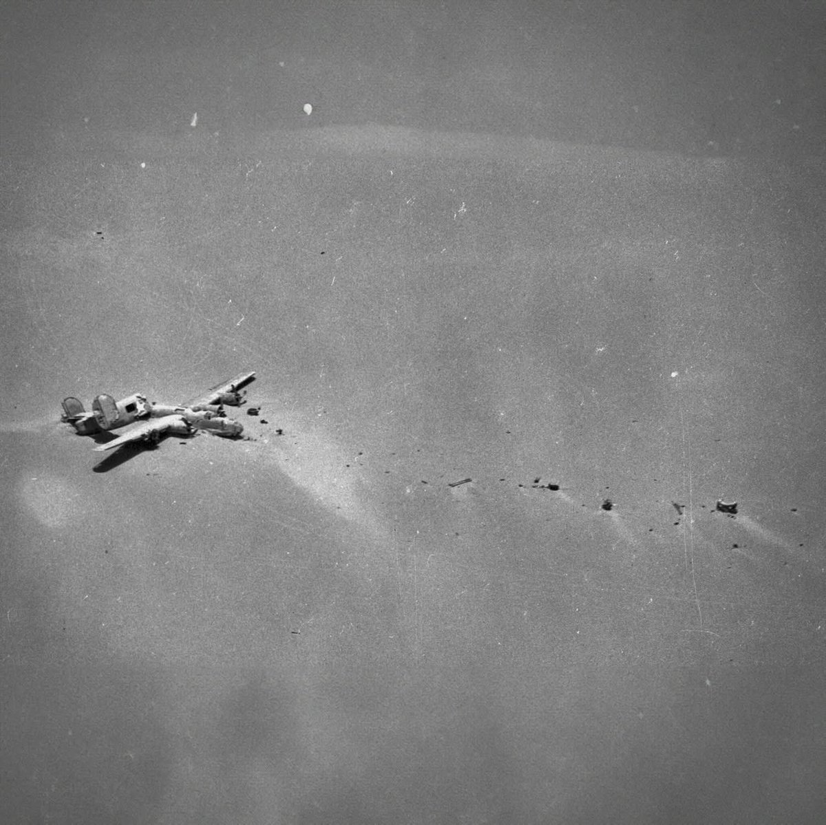 The wreck of B-24D 'Lady Be Good' lies in the Libyan desert, discovered on May 16, 1959—over 15 years after vanishing on an April 4, 1943 mission to Naples. The bomber flew nearly 400 miles past its base, likely due to a navigational error in the dark.