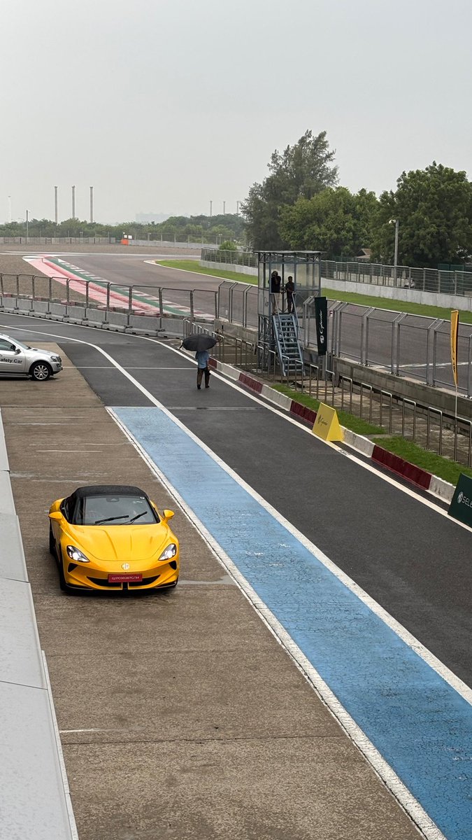 AckoDrive's tweet photo. Acko Drive is no stranger to the Buddh International Circuit, as that's where the Jury Meet for the #TOTMs happens every year! But we are at this venue today to test the @MGMotorIn Cyberster. Stay tuned to ACKO Drive to see how it performs! https://t.co/CCUyNVyGJM