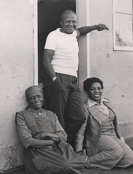 Father Desmond Tutu, first Black Anglican Dean of Johannesburg, with his mother-in-law, Mrs Johanna Shenxane &amp; his wife Mrs Leah Tutu, c 1970's.