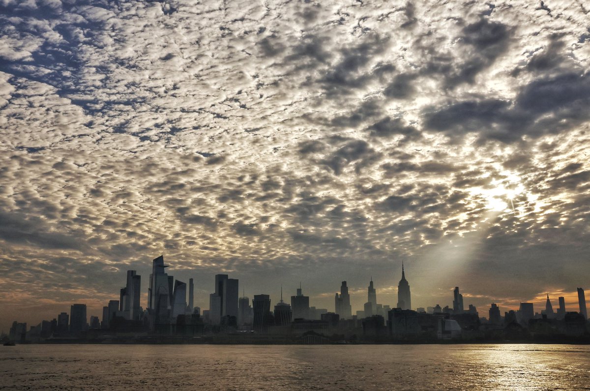 A warm start to the day as the sun rises behind the Empire State Building in New York City, seen from Hoboken, NJ, Tuesday morning #newyorkcity #nyc #newyork #sunrise #heatwave @empirestatebldg