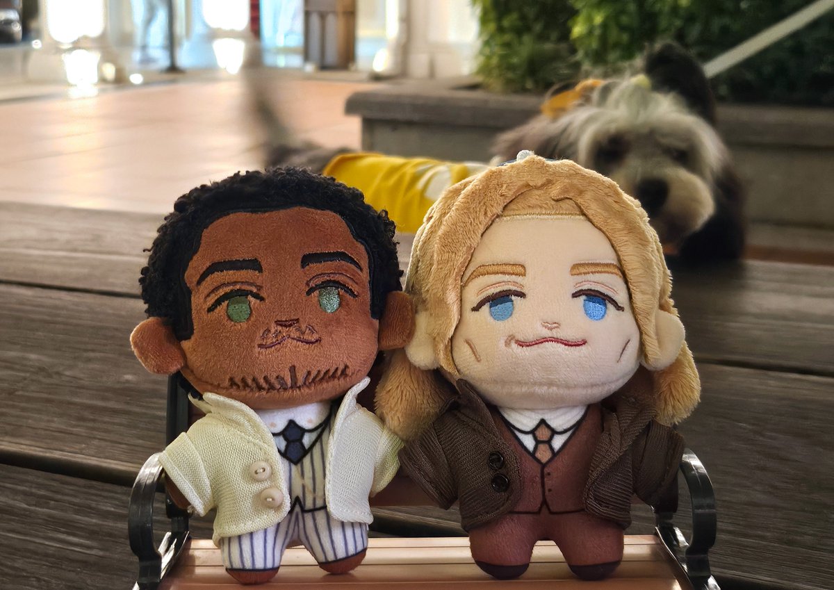 "Loustat plushies on a bench being observed by a curious Fur friend" Circa 2025.