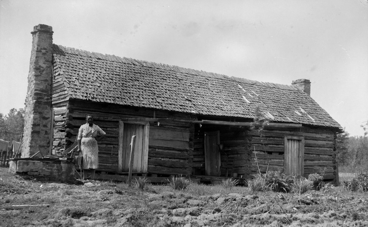 Digging thru old Dog Trot photos this'n really hit me hard.  Here lives dirt poor share croppers in late 1800's rural Alabama.  Hand hewn logs.  Shake roof.  2 stone chimneys.

This is a home most of us can't afford to build now.  Inflation has robbed us immeasurably of beauty.